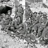 A group of New Zealand soldiers on the Cassino battlefront in Italy, during World War II. Probably reconstruction for photographers behind the line. 5 April 1944
